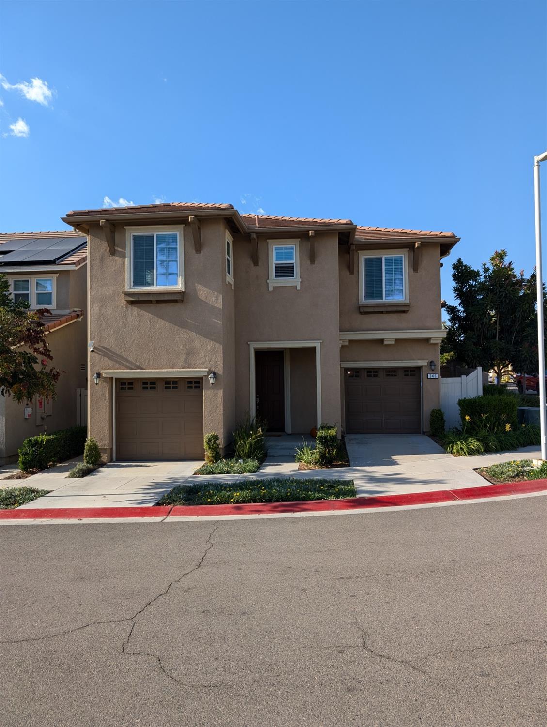 a backyard of a house with garage