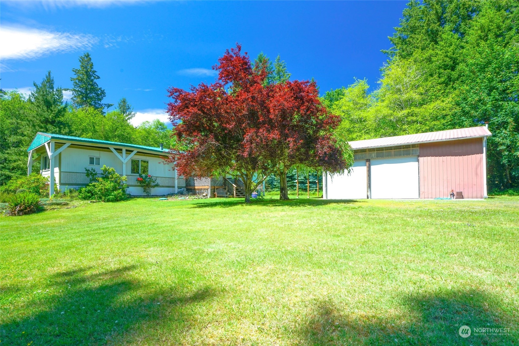 a front view of house with yard and trees