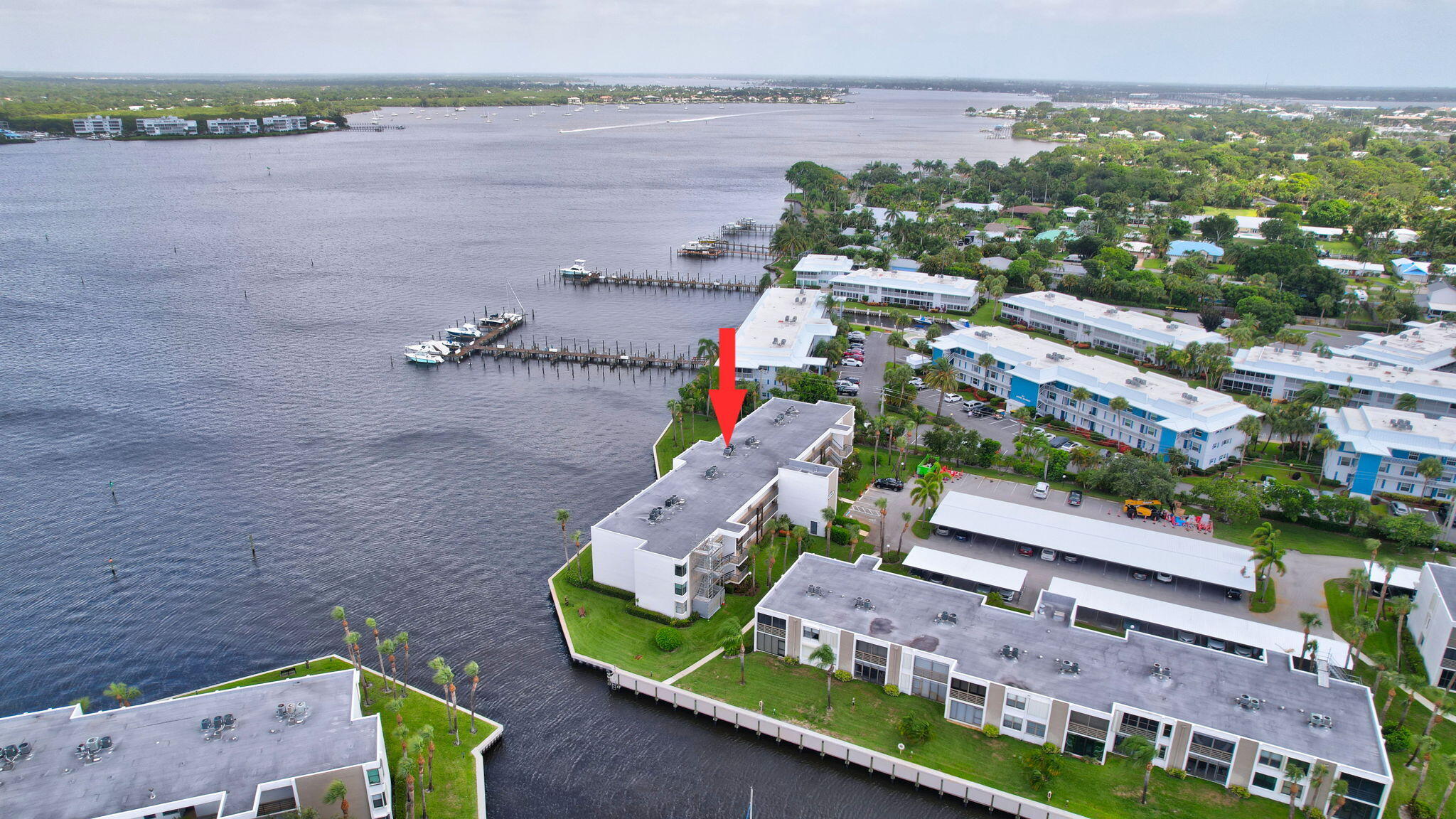 an aerial view of a house with a lake view