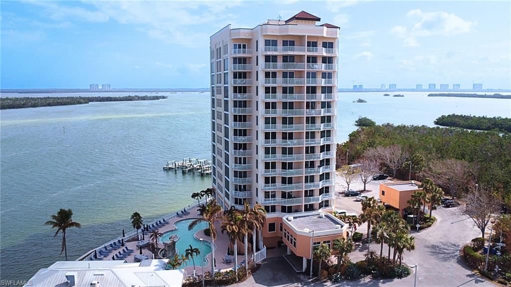 a view of building with outdoor space and lake view