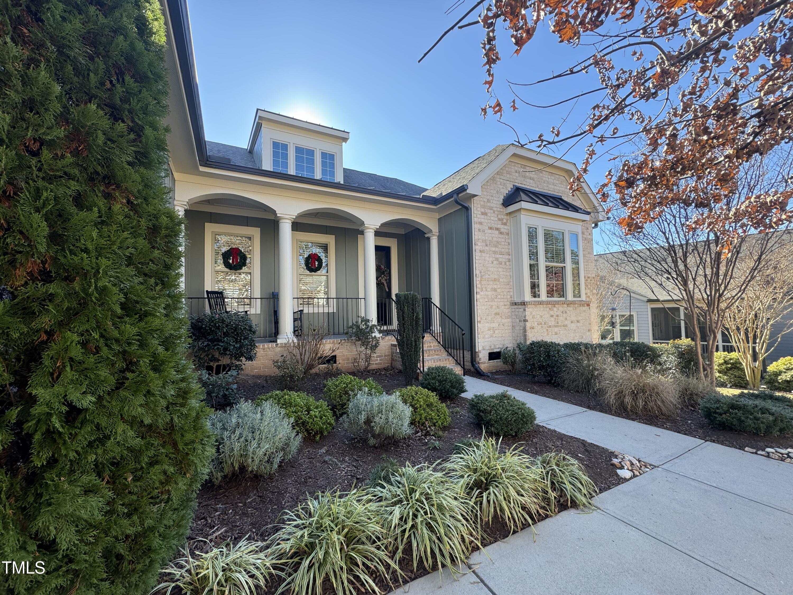 a front view of a house with garden