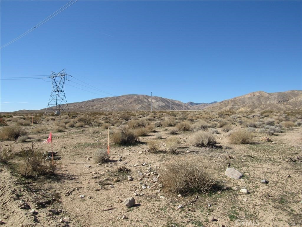 a view of a mountain view with mountains in the background