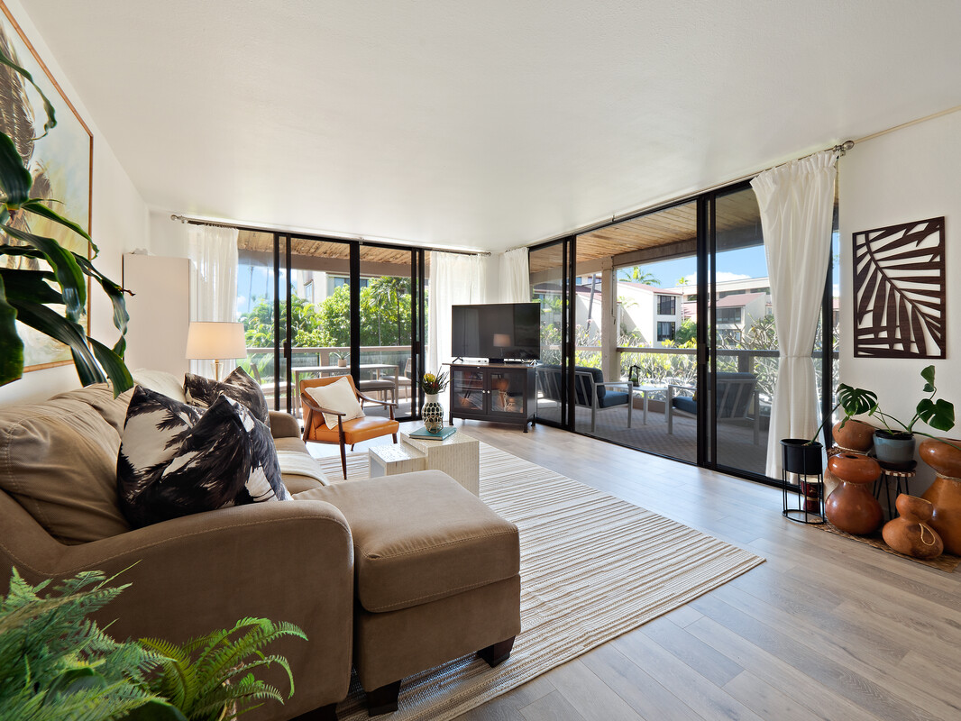 a living room with furniture fireplace and a flat screen tv