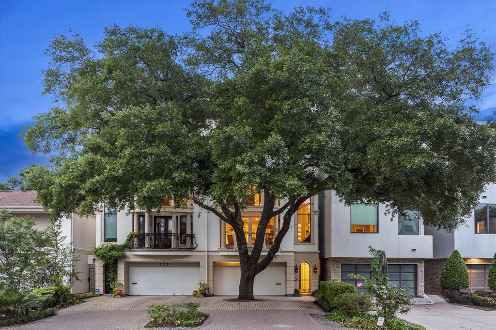 a front view of a house with trees