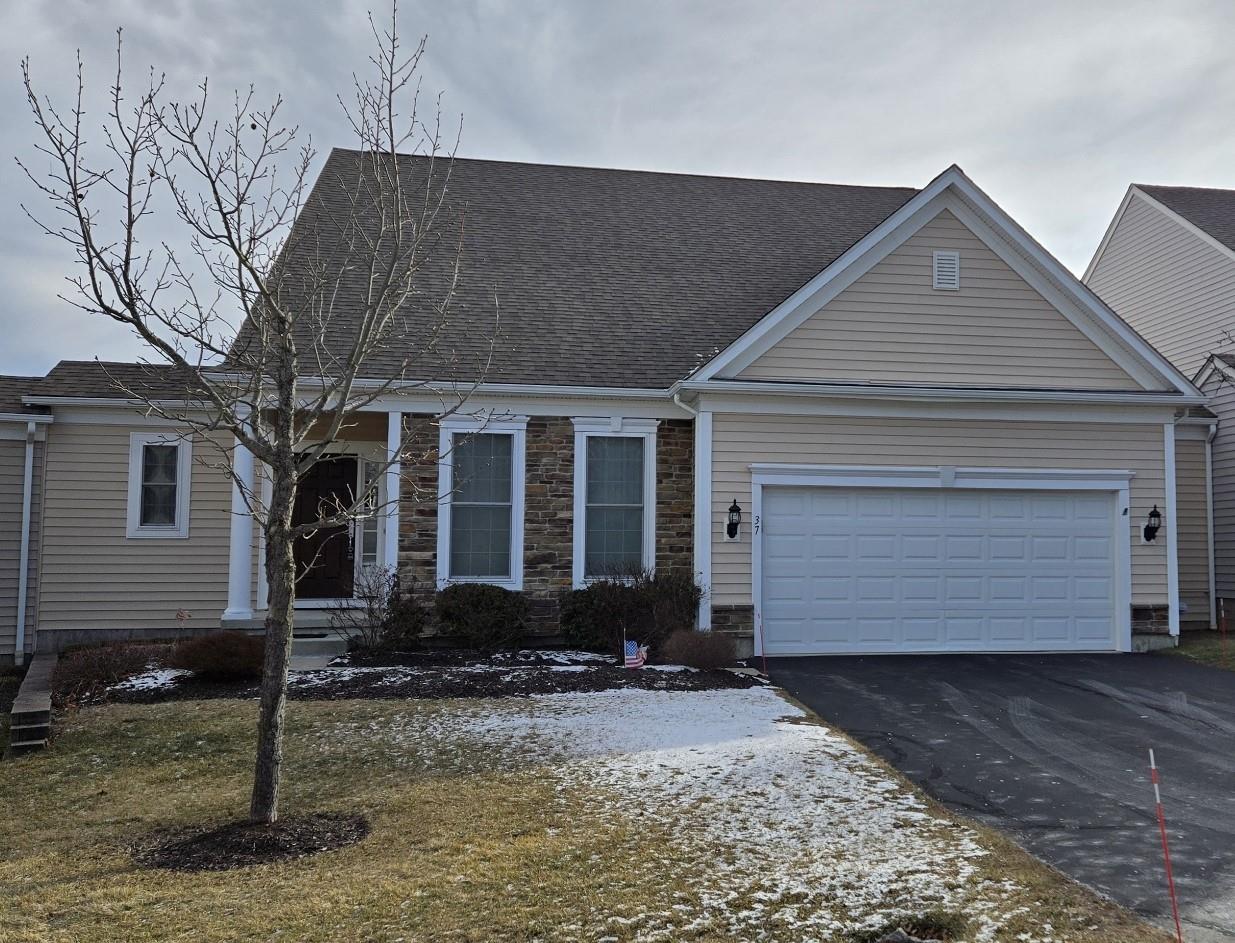 View of front facade with a garage