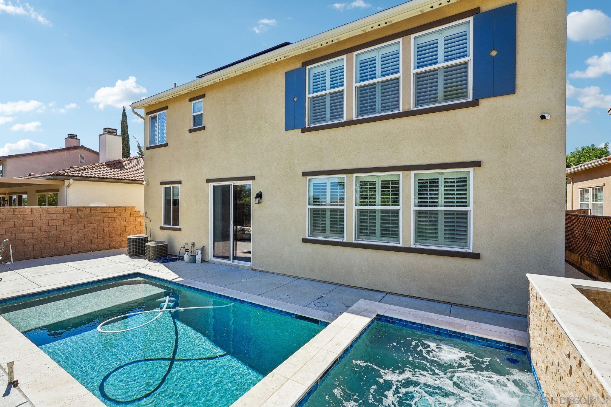 a view of a house with a swimming pool