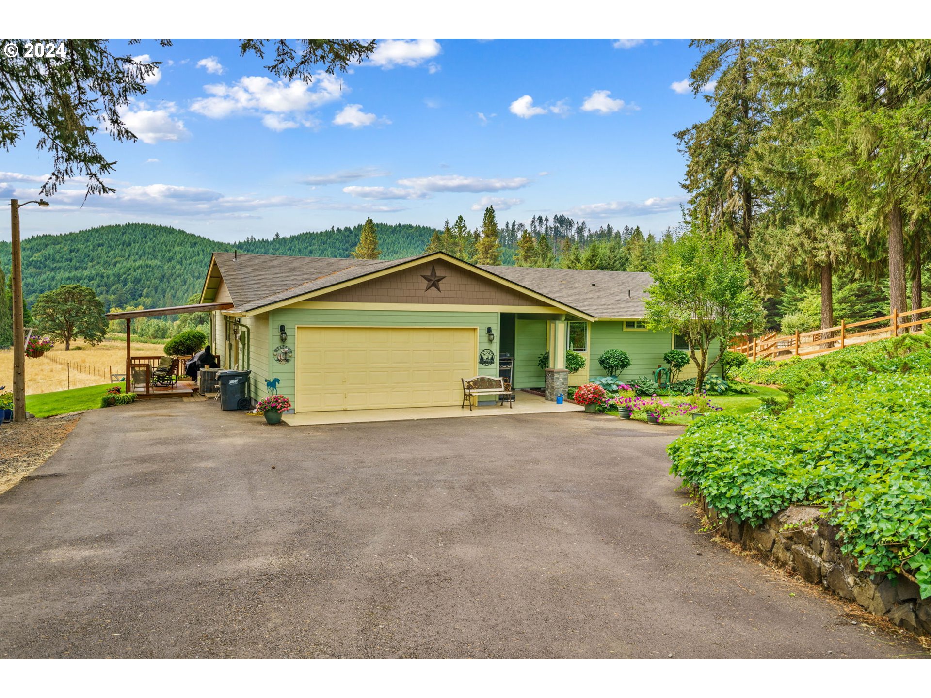 a view of a house with a yard and garage