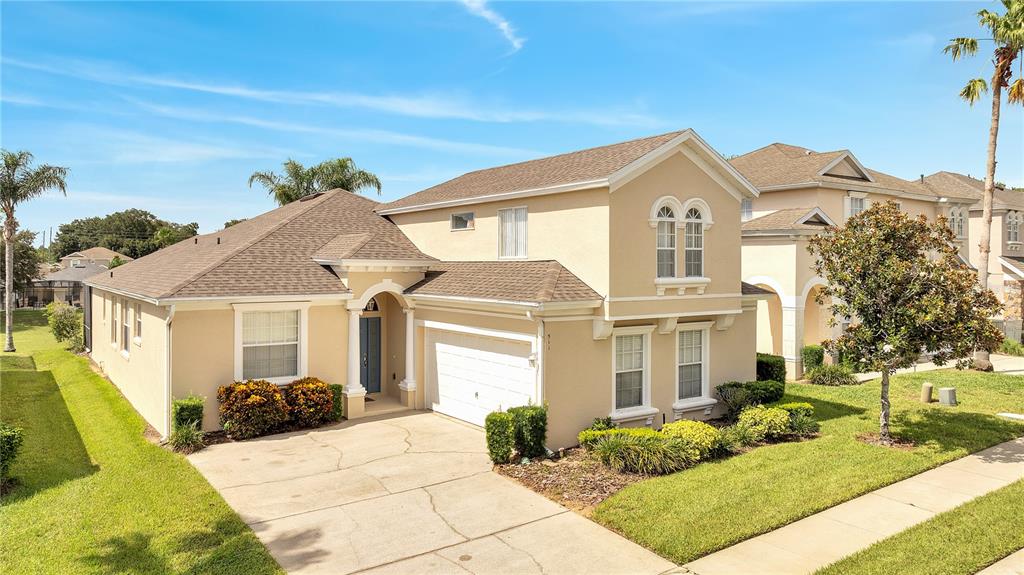 a front view of a house with a yard