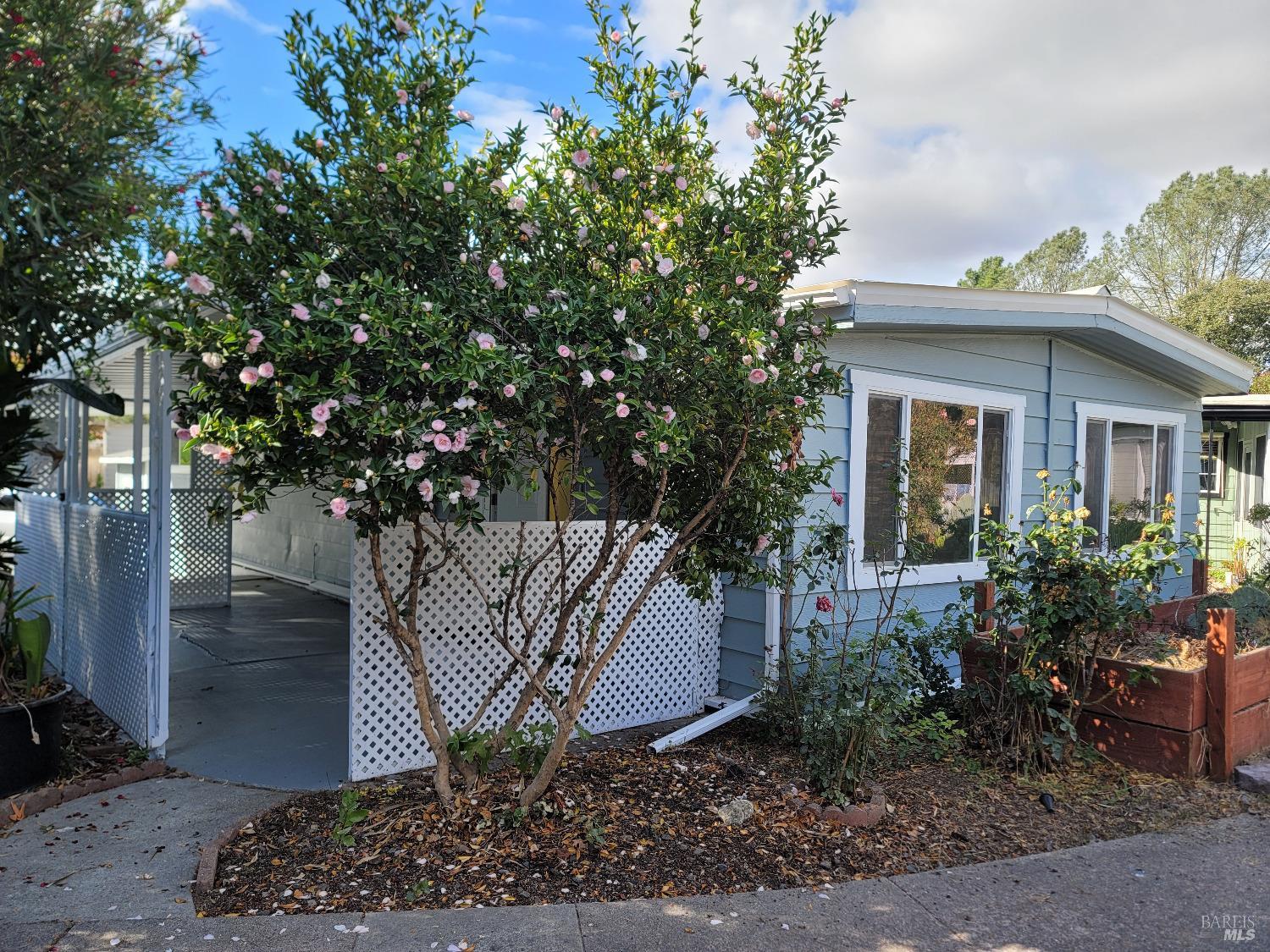 a front view of a house with garden