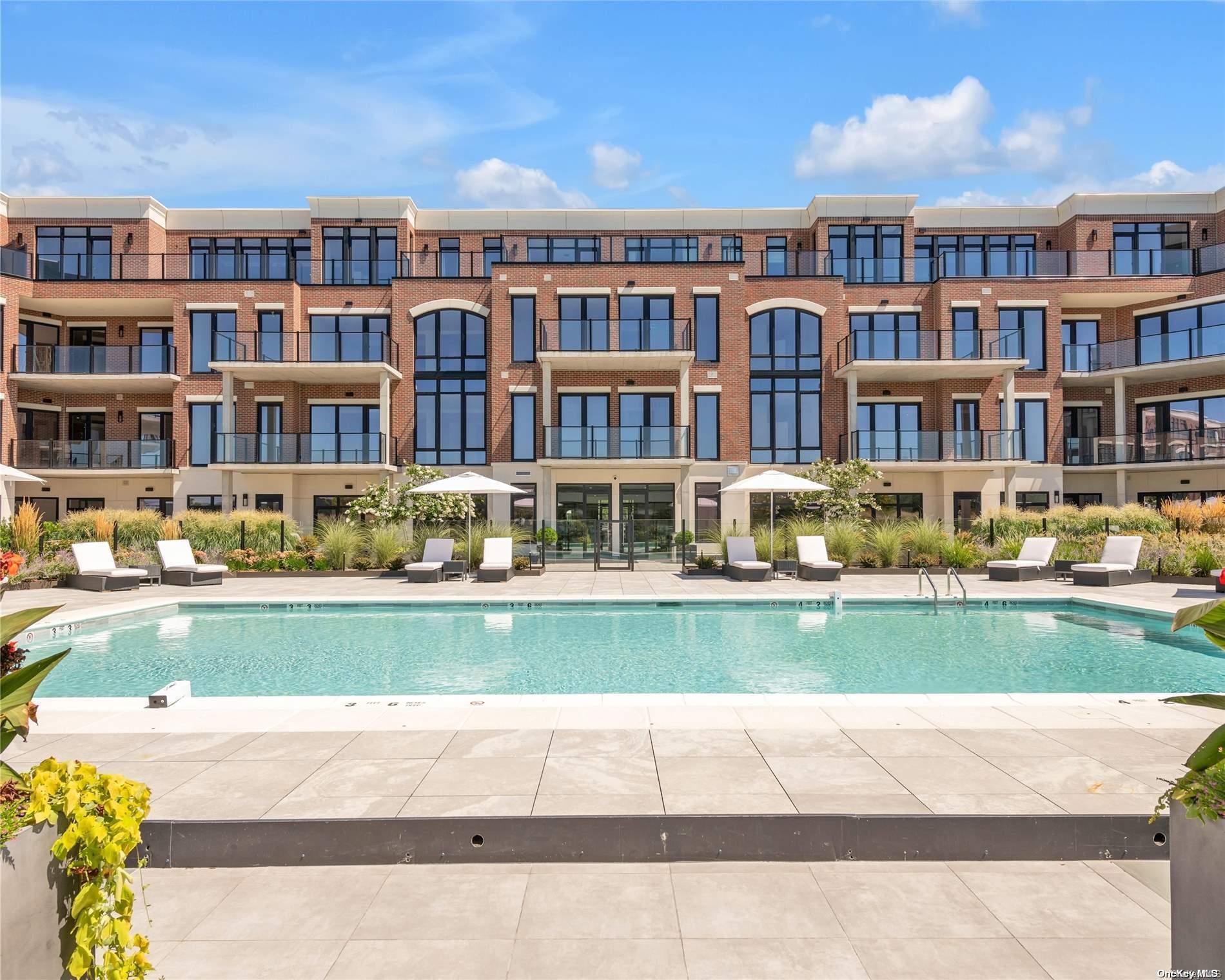 a front view of residential houses with outdoor space and swimming pool