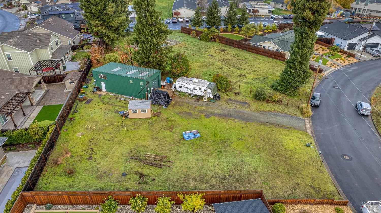 an aerial view of a residential houses with outdoor space