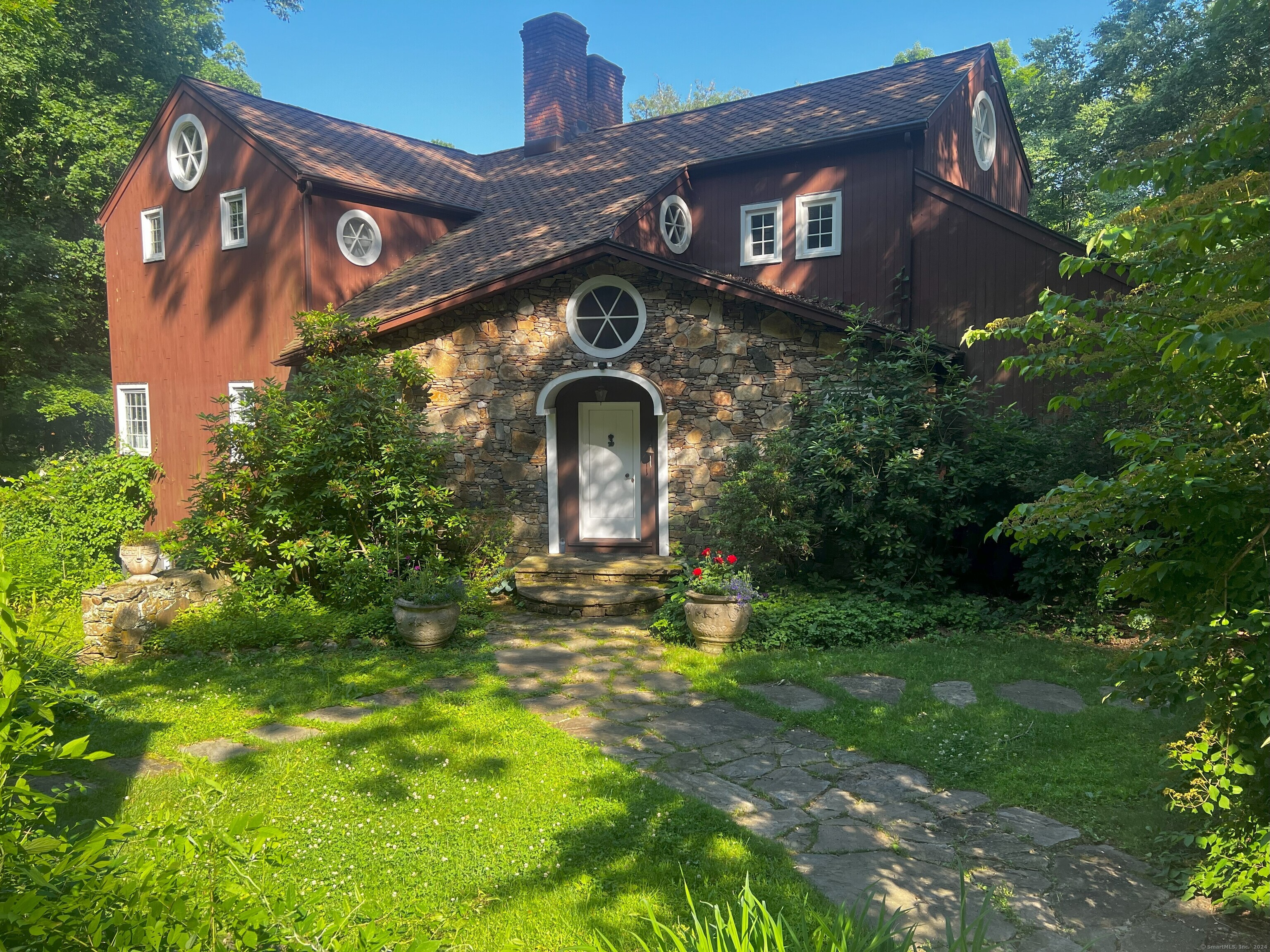 a front view of a house with garden