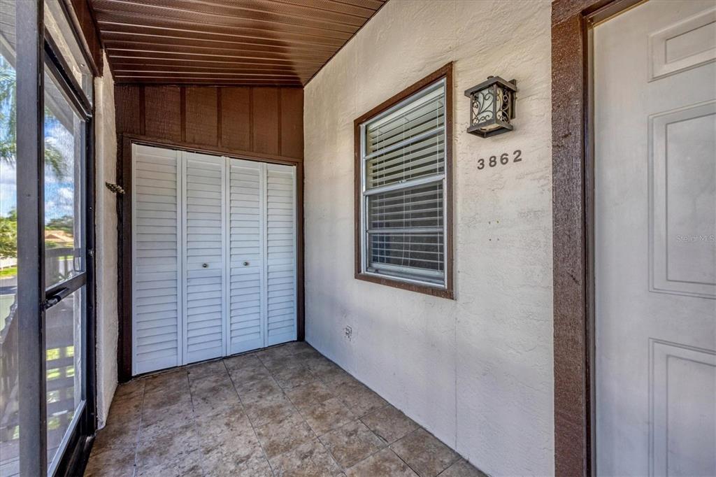 Front entry, Laundry closet, Tiled front  porch at 3862 59th Ave. W, Bradenton FL 34210