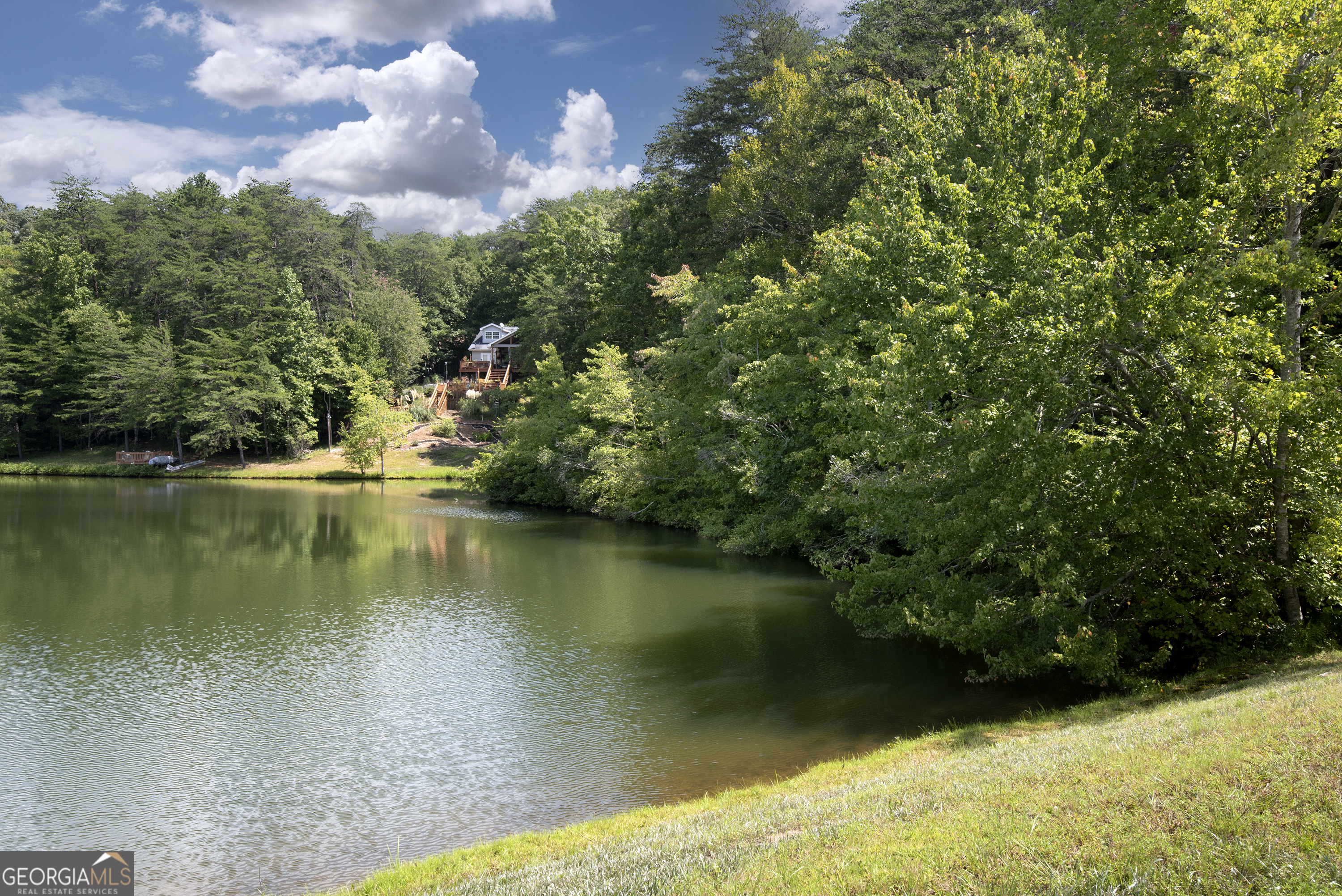 a view of a lake with a yard