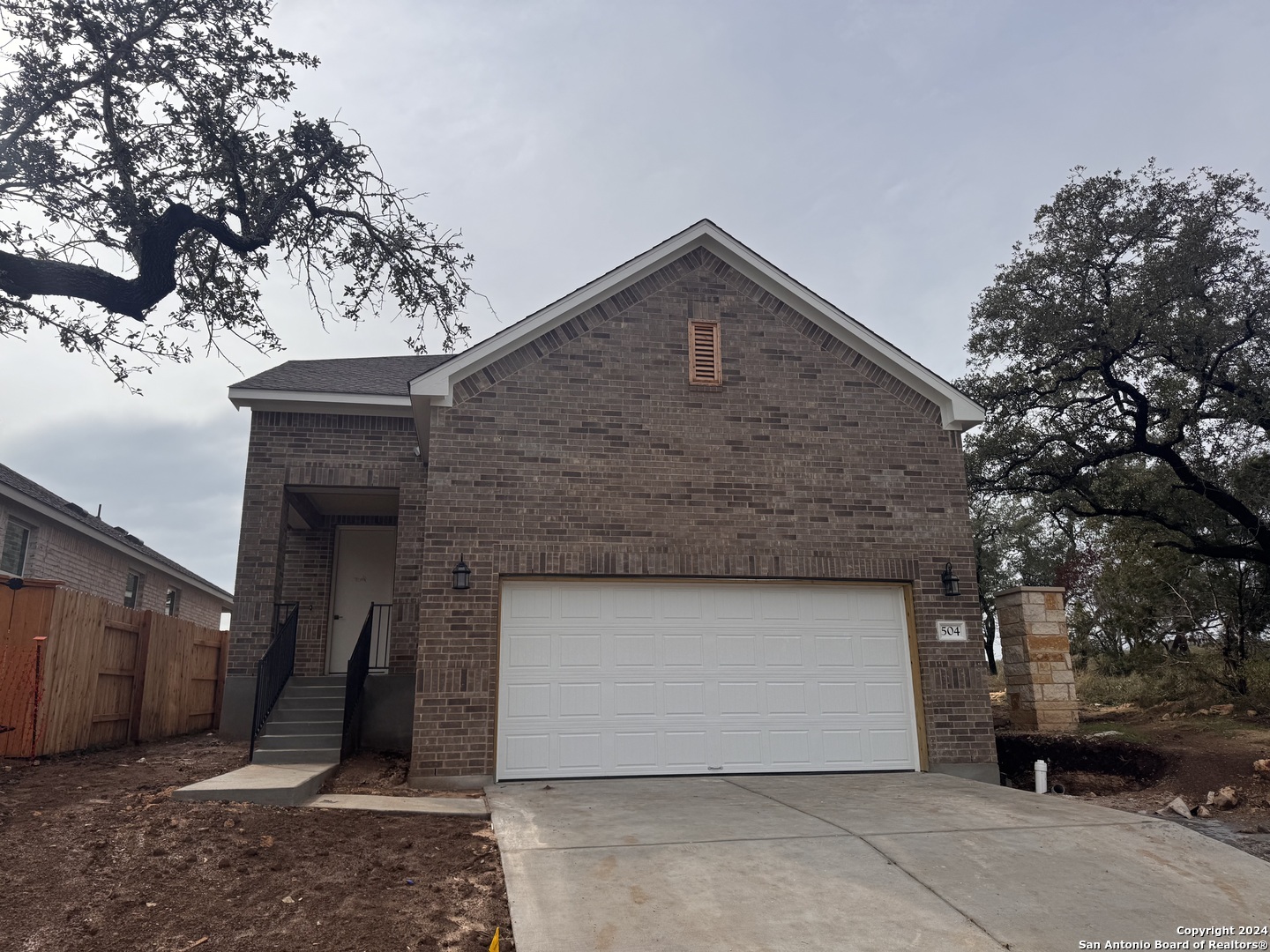 a front view of a house with a garage