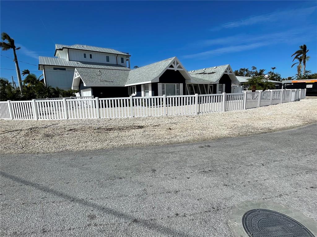 a view of a wrought iron fences in front of house