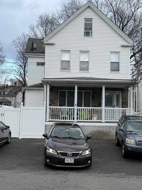 a car parked in front of a house