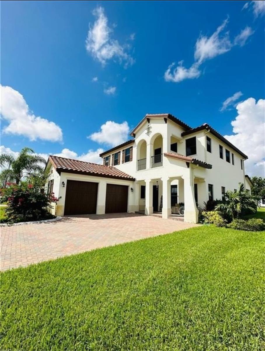 a front view of a house with a yard