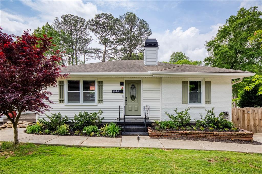 front view of a house with a yard