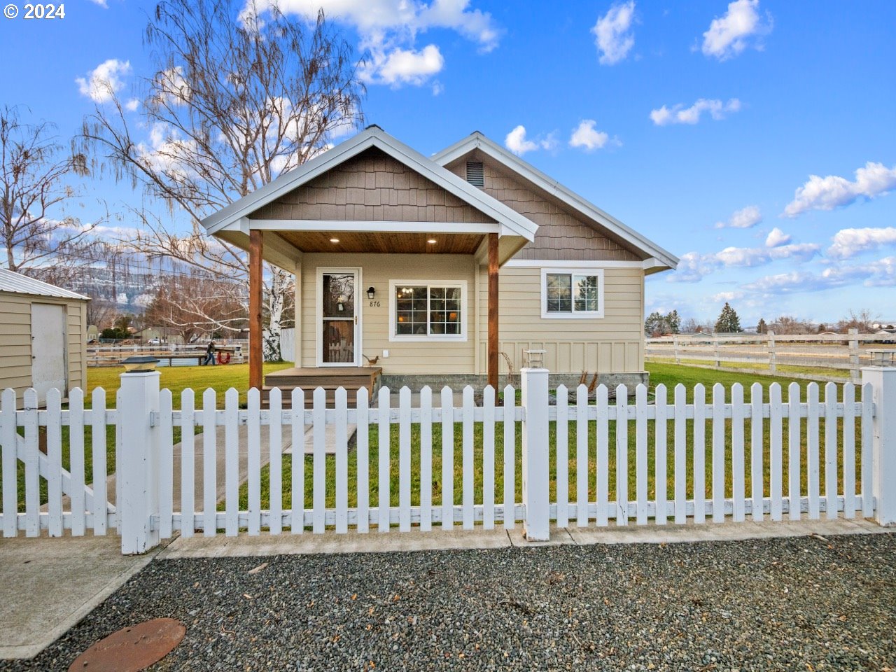 a front view of a house with a small yard