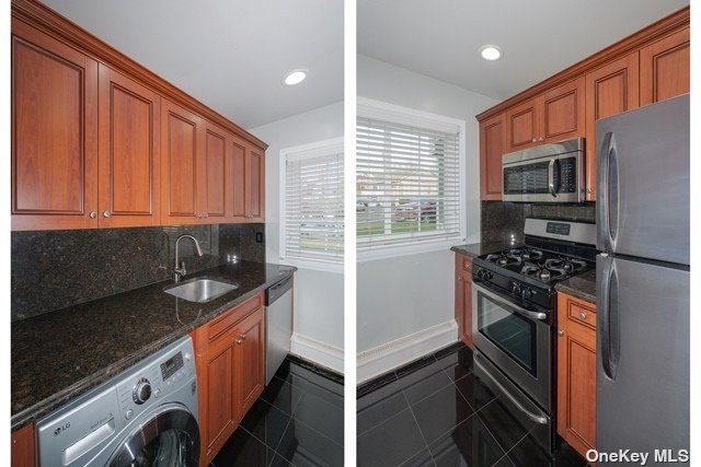 a view of kitchen with stainless steel appliances granite countertop a stove and a refrigerator