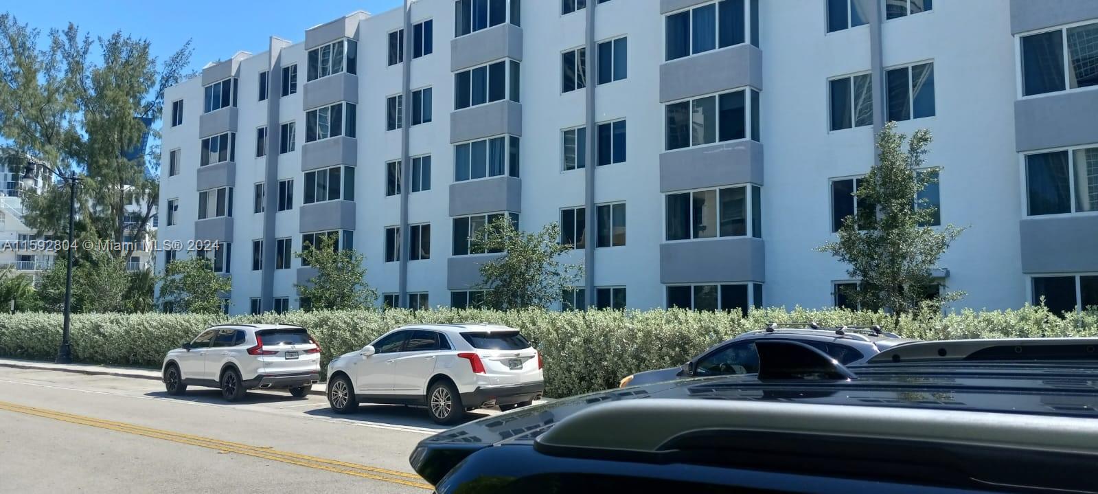 a cars parked in front of a building