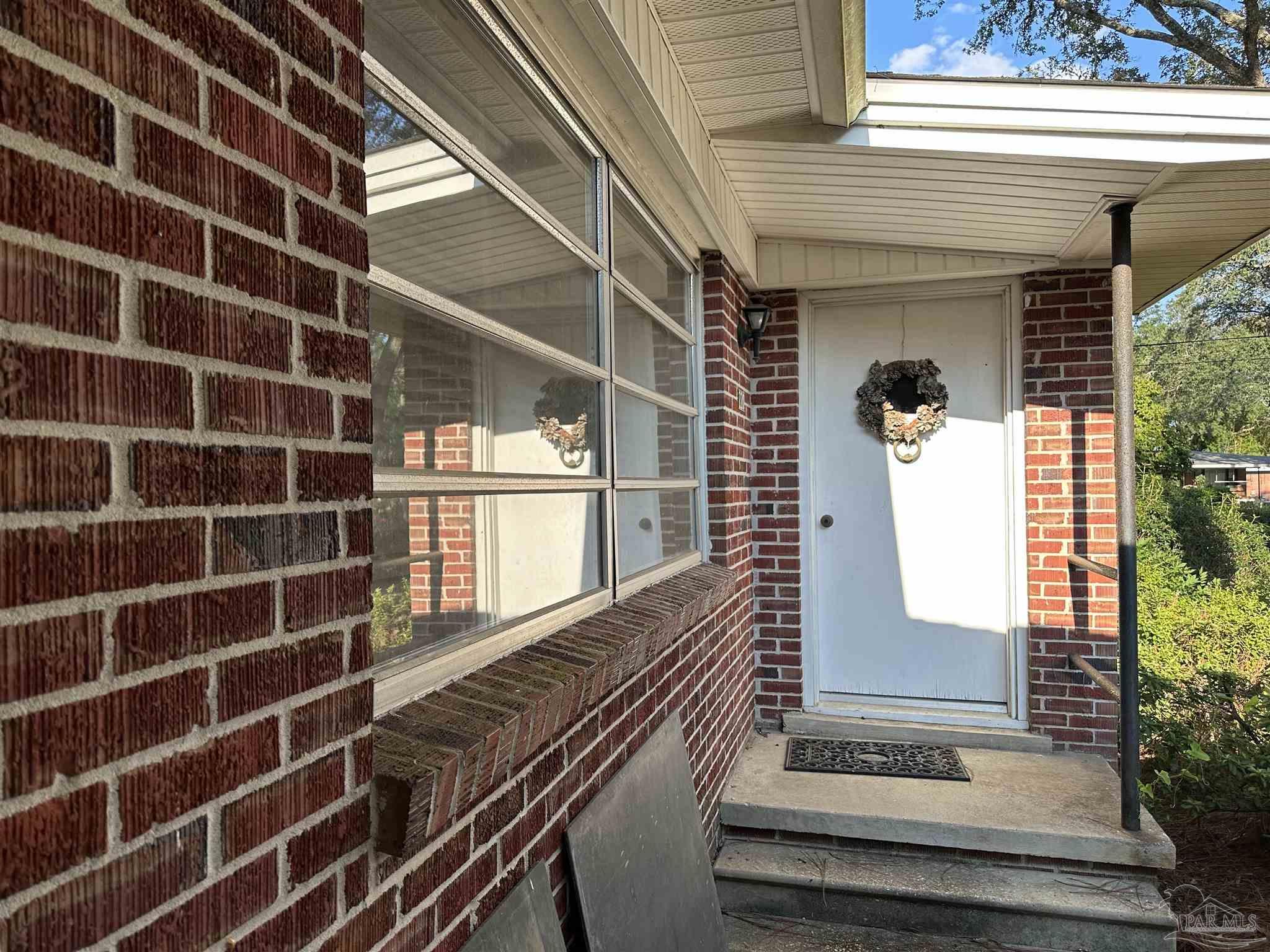 a view of a house with a large window