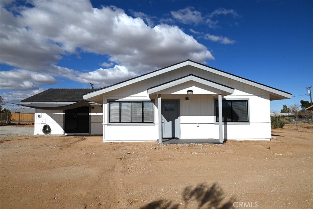 a view of a house with a back yard