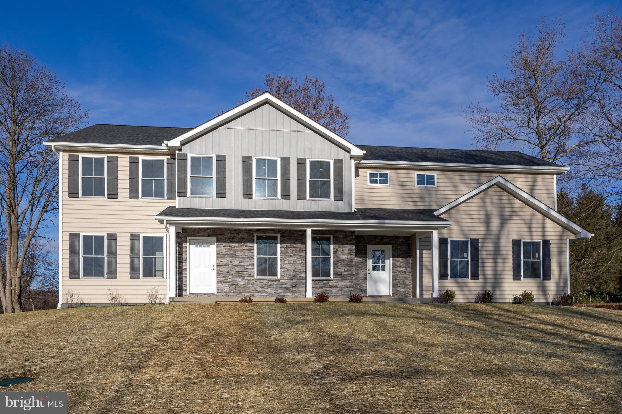 front view of a house with a yard