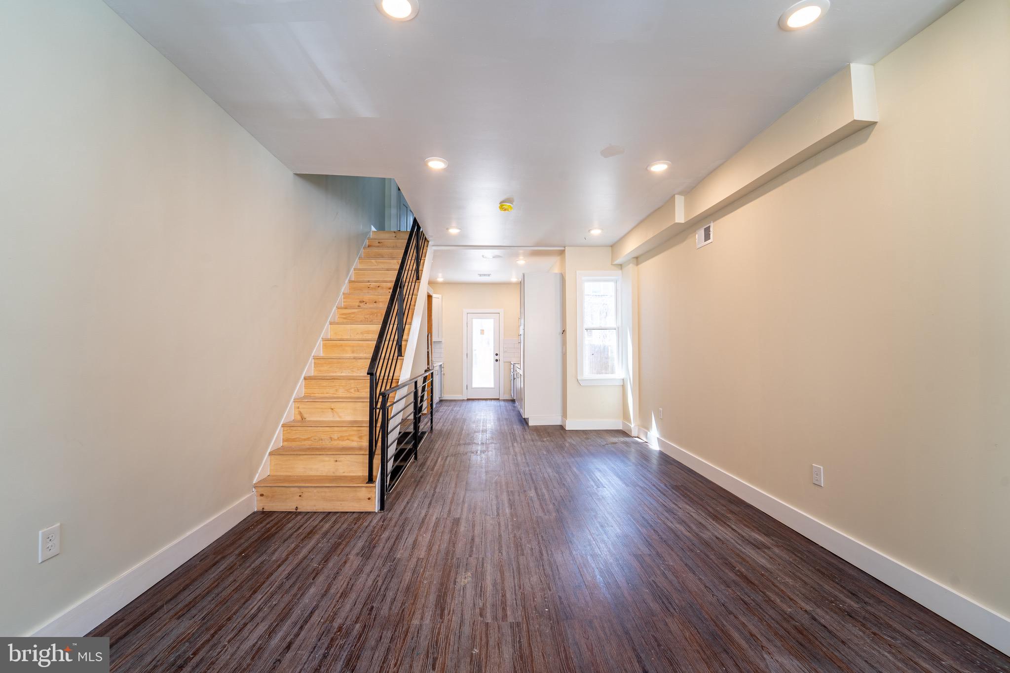 a view of entryway with wooden floor