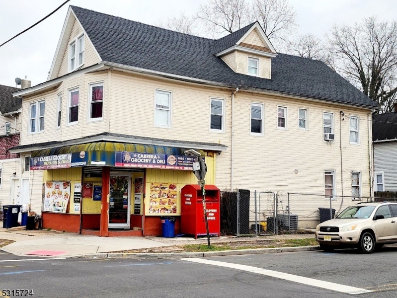 a view of a building with car parked