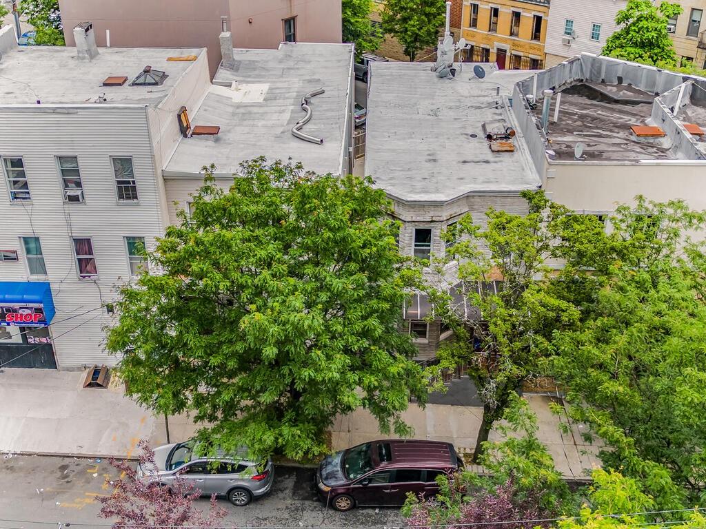 an aerial view of a house with a yard