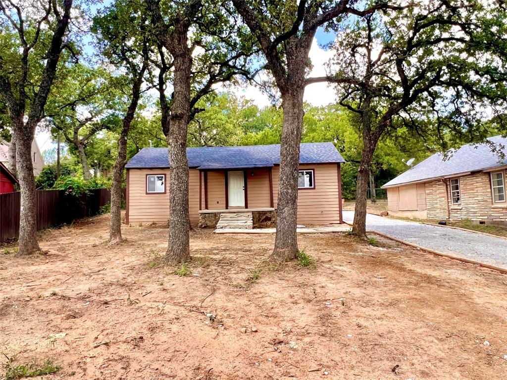 a house with trees in front of it