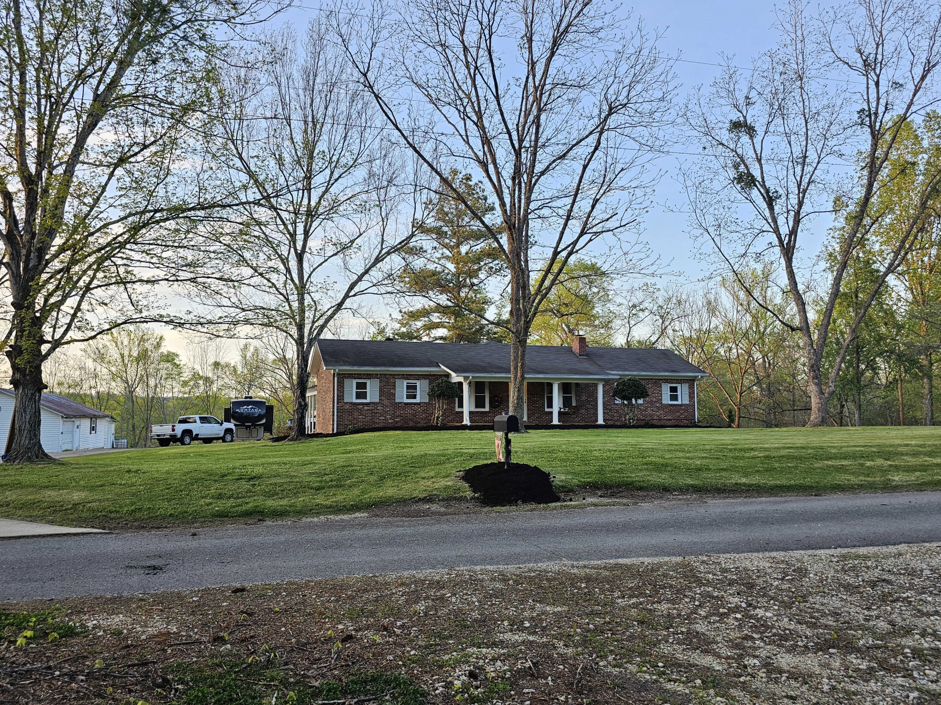 a front view of a house with a yard