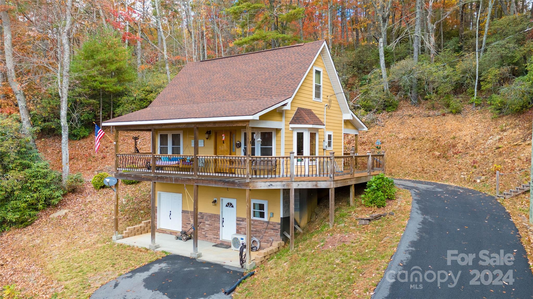 a aerial view of a house with a yard