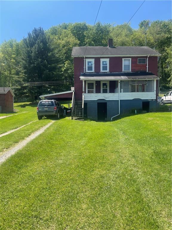 a view of a house with a big yard