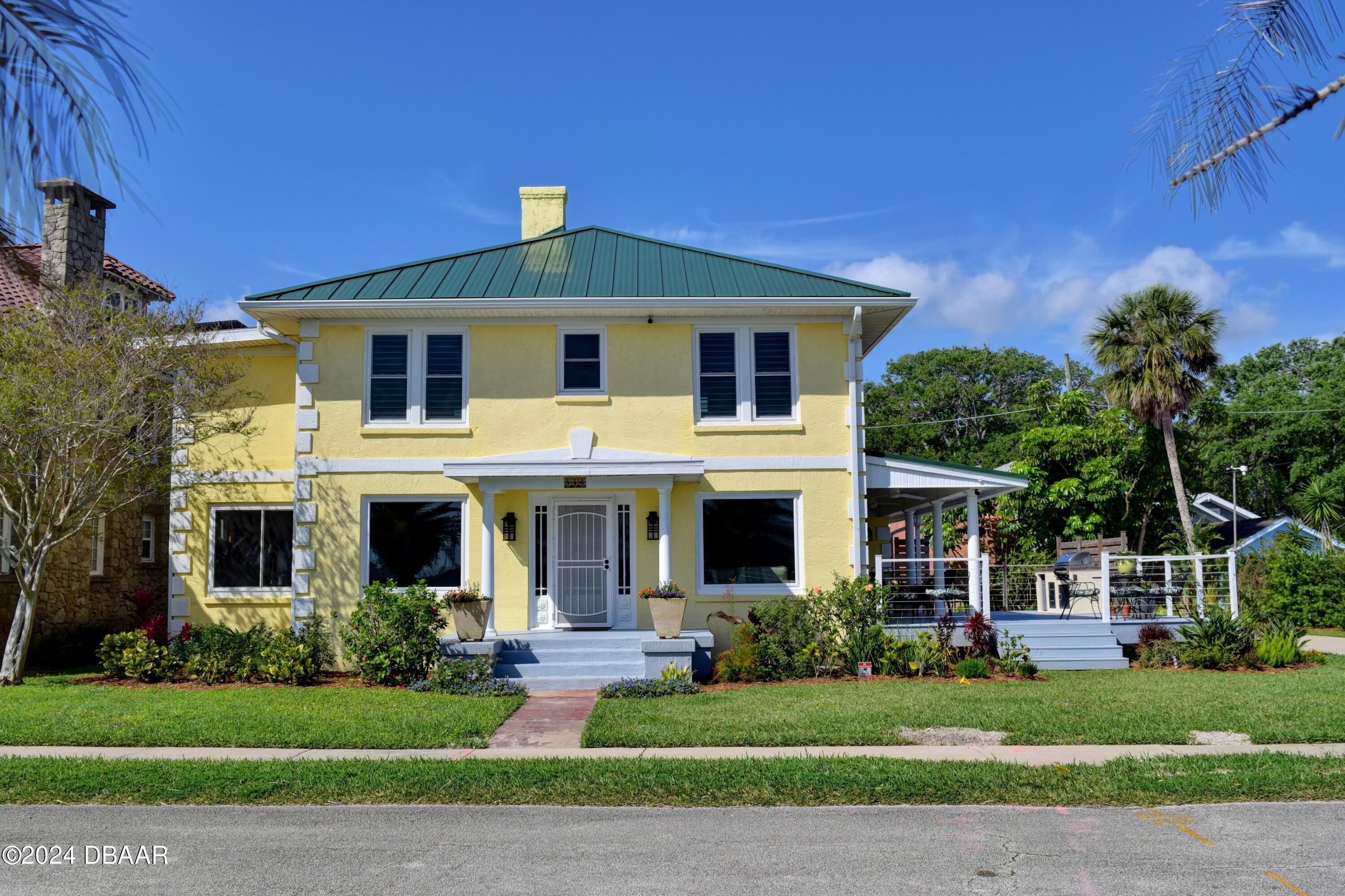 a front view of a house with a yard