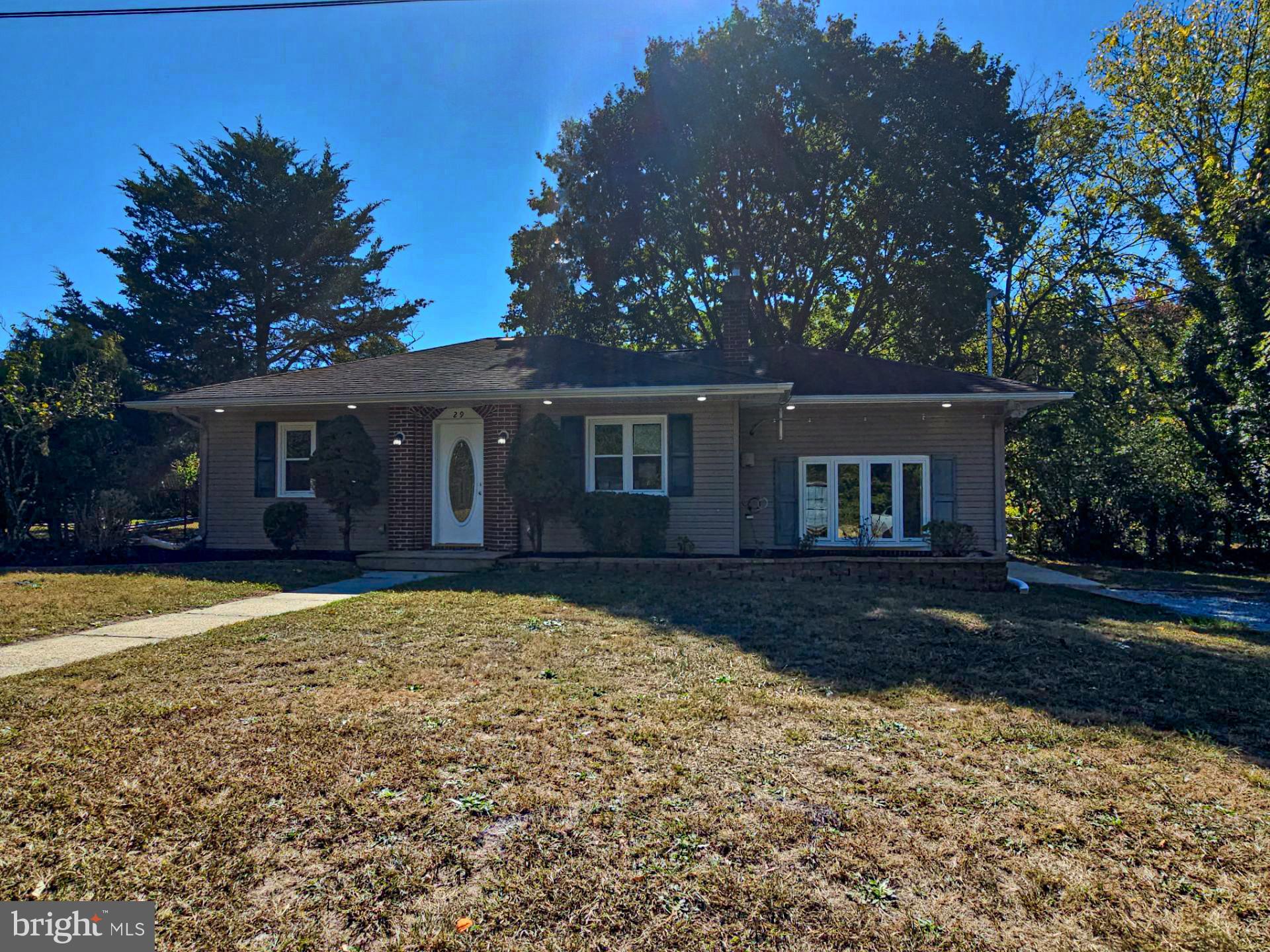 front view of a house with a yard