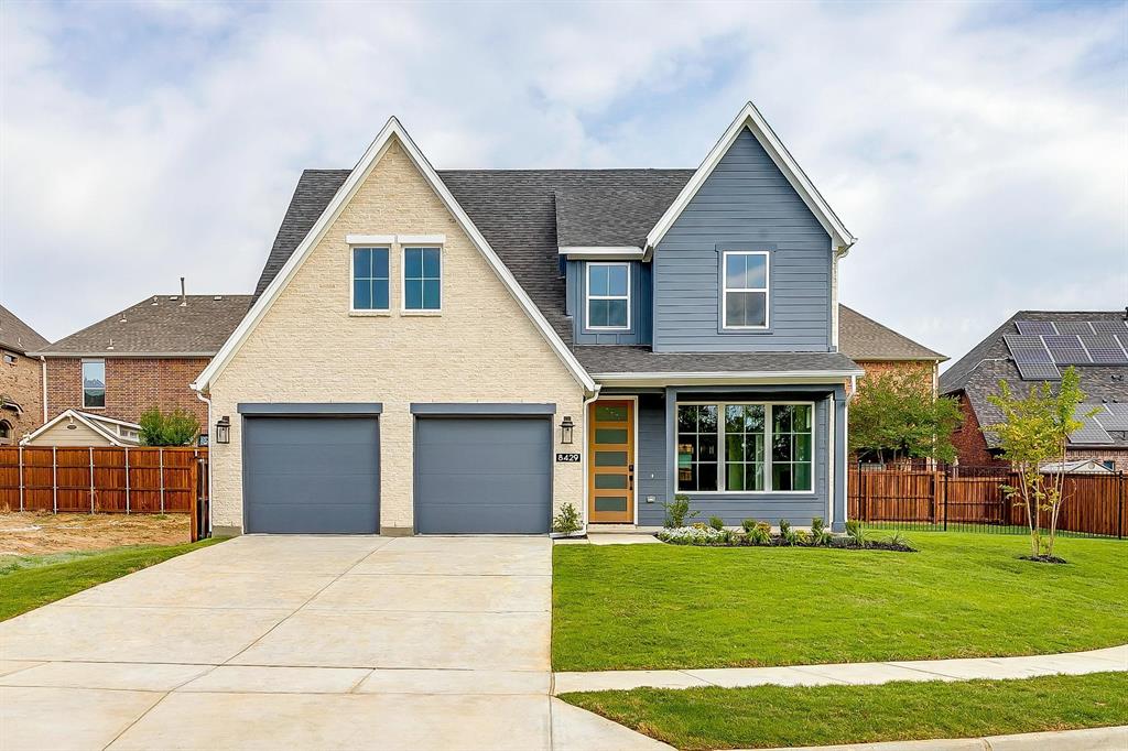 a view of a yard in front view of a house