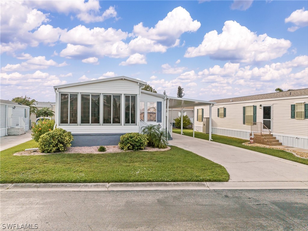 front view of a house with a yard