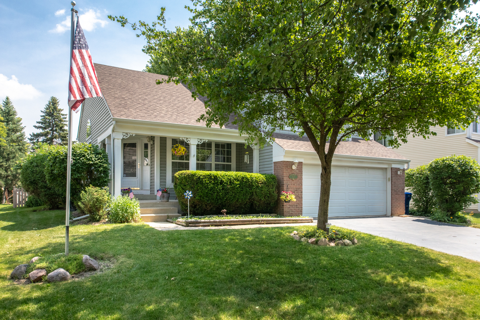 a view of a house with a yard and plants