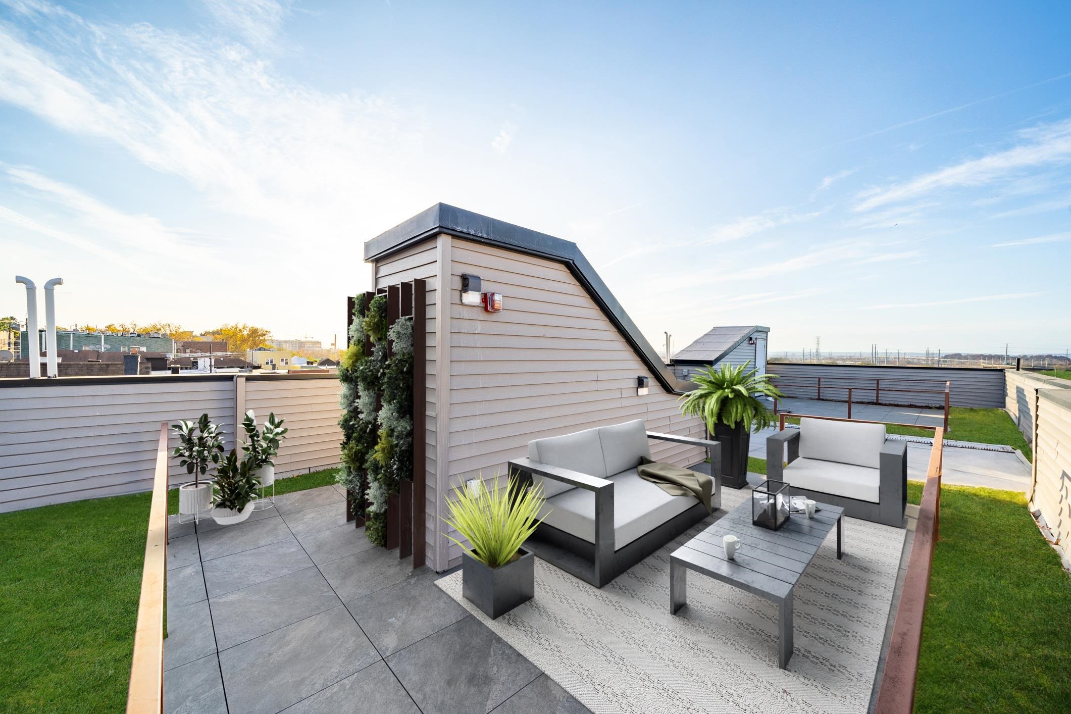 a view of a terrace with couches and a table and chairs