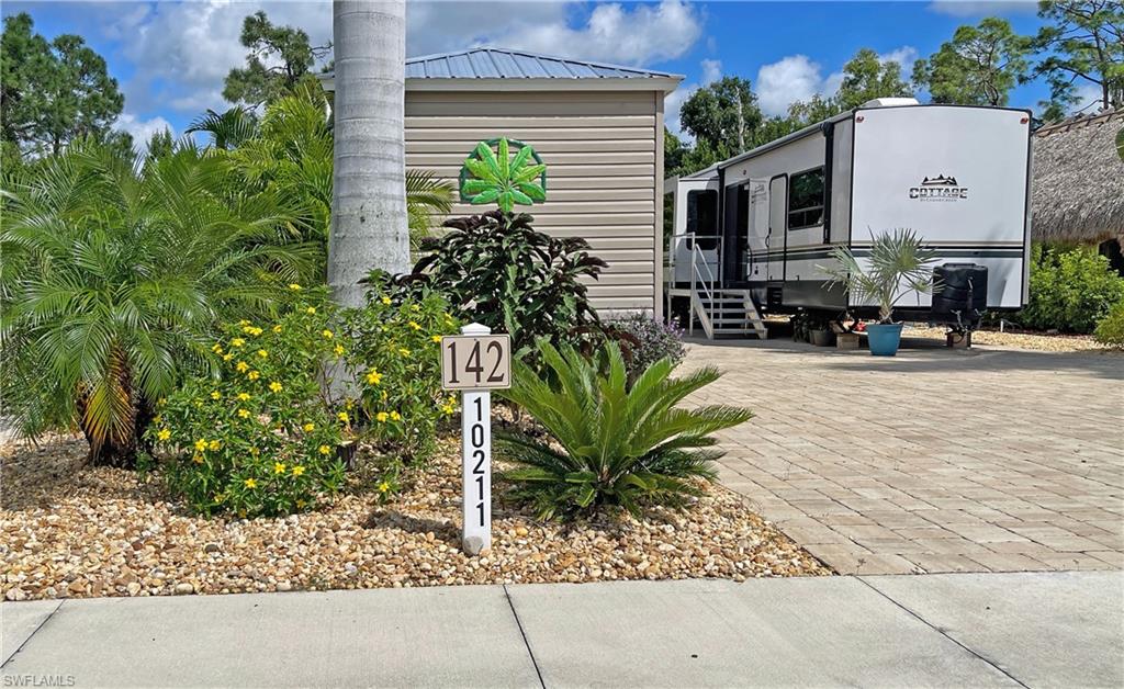 front view of house with potted plants