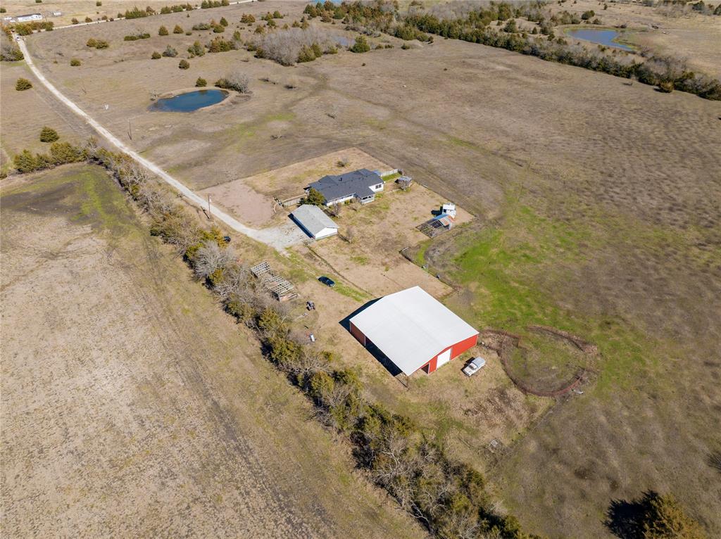 a aerial view of a backyard of a house with a yard