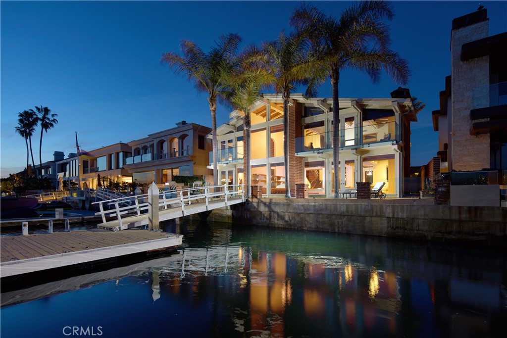 a view of house with swimming pool outdoor seating