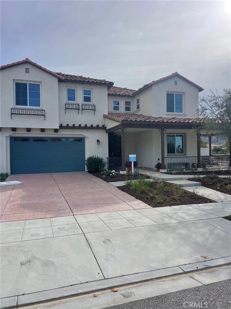 a front view of a house with yard