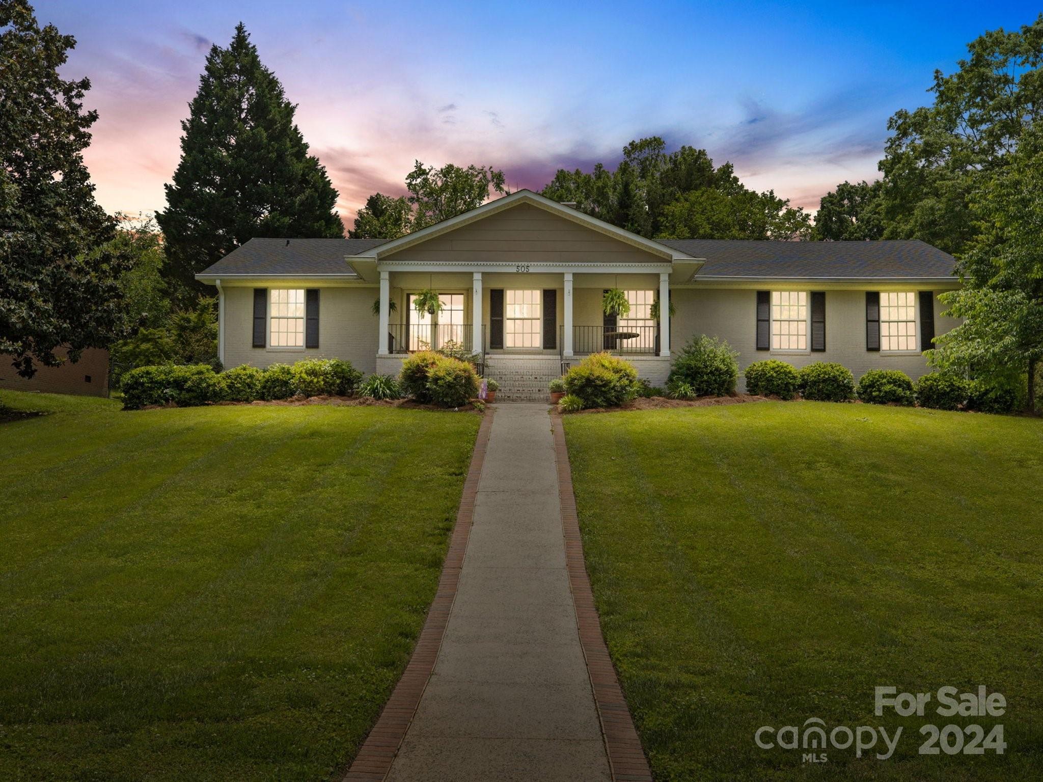 a front view of a house with yard