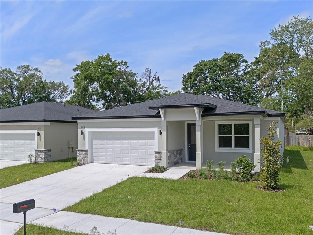 front view of a house with a yard