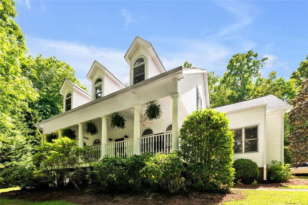 front view of a house with a garden