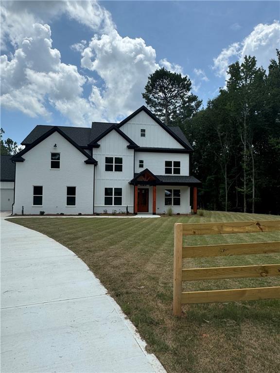 a view of a house with a backyard